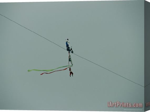 Raymond Gehman High Wire Acrobats Performing Feats of Daring Using a Small Bicycle Stretched Canvas Painting / Canvas Art