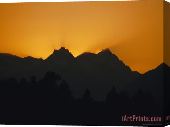 Raymond Gehman Mountain Peaks Appear in Silhouette at Twilight Stretched Canvas Painting / Canvas Art