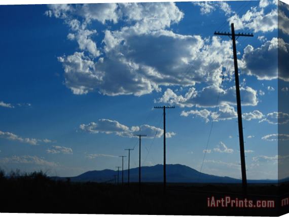 Raymond Gehman Silhouetted Telephone Poles Under Puffy Clouds Stretched Canvas Painting / Canvas Art