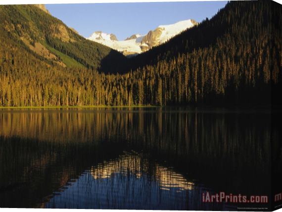 Raymond Gehman Snow Capped Mountains Reflect in a Lake Stretched Canvas Painting / Canvas Art