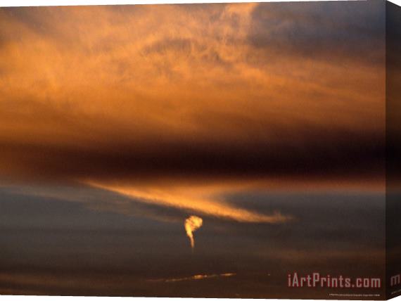 Raymond Gehman Strange Comma Like Cloud Formation at Sunset Stretched Canvas Print / Canvas Art