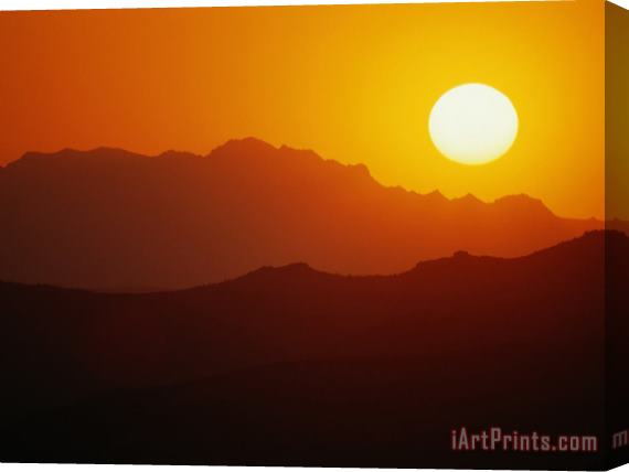 Raymond Gehman Sunset Over Silhouetted Mountain Ridges Stretched Canvas Print / Canvas Art