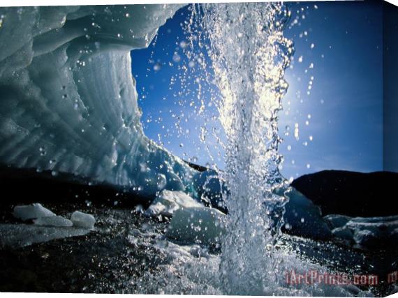 Raymond Gehman Water Splashes Over a Sheet of Ice on Wolf Creek Stretched Canvas Print / Canvas Art