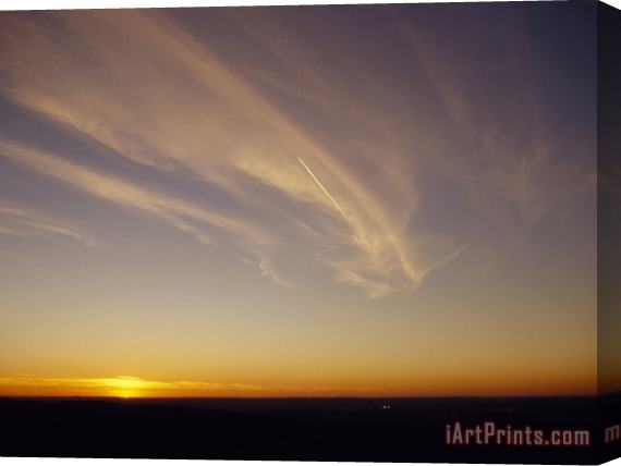 Raymond Gehman Wispy Clouds And Jet Vapor Trail in The Sky at Sunset Stretched Canvas Painting / Canvas Art