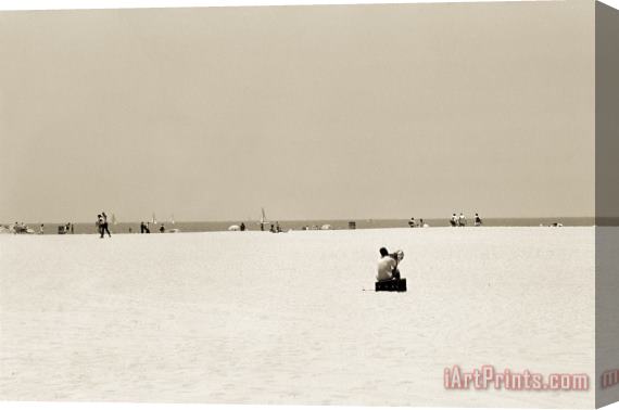 Stephen Spiller Man Sitting On A Beach Playing His Horn Stretched Canvas Print / Canvas Art